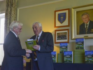 3) President Joe Duignan receives a copy of the Powerscourt Golf Club 20th Anniversary Book from John Power – Chairman of the Book Committee.